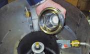 Blowoff metal parts in a vacuum chamber